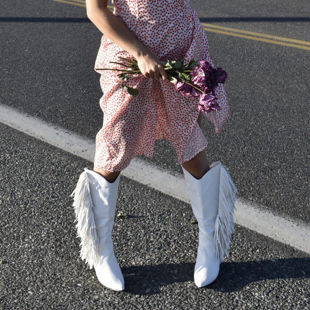 Girl wearing Cowboy boots in the road